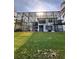 Spacious backyard featuring lush lawn and large screened in enclosure at 1407 Water Lilly Ln, Kissimmee, FL 34744