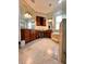 Primary bathroom boasts double vanity, granite countertops, and a separate soaking tub at 1407 Water Lilly Ln, Kissimmee, FL 34744