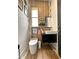 Modern bathroom with wood wall, floating sink, and tiled flooring at 1407 Water Lilly Ln, Kissimmee, FL 34744