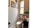 Modern bathroom featuring wood-look tile, unique decor, and a contemporary sink at 1407 Water Lilly Ln, Kissimmee, FL 34744