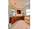 Primary bathroom boasts double vanity, granite countertops, and a separate soaking tub at 1407 Water Lilly Ln, Kissimmee, FL 34744