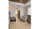 Bedroom featuring a comfortable armchair and a view of the en suite bathroom at 1407 Water Lilly Ln, Kissimmee, FL 34744