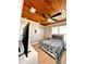 Comfortable bedroom with stained wood ceiling, modern ceiling fan, and decorative bedspread at 1407 Water Lilly Ln, Kissimmee, FL 34744