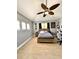 Bright bedroom with modern furnishings and decor, light-colored flooring, and ceiling fan at 1407 Water Lilly Ln, Kissimmee, FL 34744