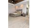 Bedroom featuring wood floors, a decorative bed, stylish nightstands, and ambient lighting at 1407 Water Lilly Ln, Kissimmee, FL 34744
