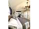 Cozy bedroom featuring gray walls, modern furnishings, and a large ceiling fan at 1407 Water Lilly Ln, Kissimmee, FL 34744