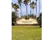 Kissimmee Bay Country Club entrance sign surrounded by lush landscaping at 1407 Water Lilly Ln, Kissimmee, FL 34744