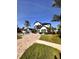 Beautiful two story home featuring brick paved driveway, a front fountain, and well manicured landscaping at 1407 Water Lilly Ln, Kissimmee, FL 34744