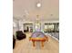 Bright game room with pool table and access to a gym through glass doors at 1407 Water Lilly Ln, Kissimmee, FL 34744