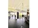 A bright gym featuring a punching bag, free weights, exercise machines, and large windows at 1407 Water Lilly Ln, Kissimmee, FL 34744