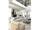 Expansive living room features marble floors, second story balcony view, and modern open layout at 1407 Water Lilly Ln, Kissimmee, FL 34744