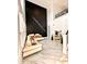 Interior view of living room featuring marble floors, large wall art, recessed lighting and second floor balcony at 1407 Water Lilly Ln, Kissimmee, FL 34744