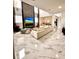 Open concept living room features marble floors, fireplace, and dining area for modern living at 1407 Water Lilly Ln, Kissimmee, FL 34744