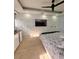 Modern bedroom offering plenty of storage, custom lighting, and a large television at 1407 Water Lilly Ln, Kissimmee, FL 34744