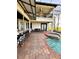 Inviting outdoor pool area with a bar, comfortable seating, and a relaxing hot tub at 1407 Water Lilly Ln, Kissimmee, FL 34744