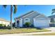 Charming single-story home with a well-manicured lawn and attached two-car garage at 16732 Glenbrook Blvd, Clermont, FL 34714