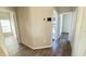 Hallway featuring modern flooring and a view into multiple rooms of the home at 16732 Glenbrook Blvd, Clermont, FL 34714