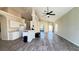 Bright living room with soaring ceilings and seamless flooring into the dining area at 16732 Glenbrook Blvd, Clermont, FL 34714