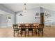 Bright dining room featuring a wooden table with seating, wood floors, and decorative elements at 1700 E Clinton Dr, St Cloud, FL 34769