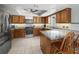 Well-appointed kitchen featuring ample cabinetry, modern appliances, and a breakfast bar at 1700 E Clinton Dr, St Cloud, FL 34769