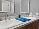 Modern bathroom featuring a double sink vanity with marble countertops at 1849 Kings Point Blvd, Kissimmee, FL 34744