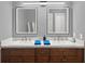 Elegant bathroom featuring double sinks, stylish mirrors, and modern fixtures at 1849 Kings Point Blvd, Kissimmee, FL 34744