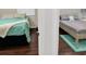 This view of two bedrooms shows the contrast in decor and furniture options at 1849 Kings Point Blvd, Kissimmee, FL 34744