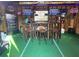 Interior shot of a bar space within the hurricane shelter featuring multiple tv screens and stools at 1849 Kings Point Blvd, Kissimmee, FL 34744