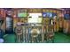 Interior shot of the bar space within the hurricane shelter featuring a wooden bar and multiple tv screens at 1849 Kings Point Blvd, Kissimmee, FL 34744