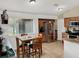 Kitchen with stainless steel appliances and a breakfast nook featuring a square dining table at 1849 Kings Point Blvd, Kissimmee, FL 34744