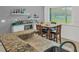Kitchen features an eat-in breakfast nook, stainless steel appliances, and granite countertops at 1849 Kings Point Blvd, Kissimmee, FL 34744
