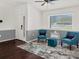 Inviting living room showcasing stylish decor, ceiling fan, and a bright window at 1849 Kings Point Blvd, Kissimmee, FL 34744