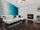Chic living room with white leather sofa, fireplace, and stylish decor at 1849 Kings Point Blvd, Kissimmee, FL 34744