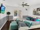Comfortable main bedroom with large bed, soft lighting, and view to the pool area at 1849 Kings Point Blvd, Kissimmee, FL 34744