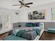Beautiful main bedroom with large bed and patio door to the backyard at 1849 Kings Point Blvd, Kissimmee, FL 34744