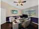 Bright office features a sit-stand desk, accent lighting, and tv to showcase the versatility at 1849 Kings Point Blvd, Kissimmee, FL 34744