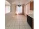 Dining area showcasing tile floors, a modern chandelier, and large windows at 1948 Bridgeview Cir, Orlando, FL 32824