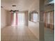 Open concept living space with arched doorways, columns, tile floors, and stylish lighting at 1948 Bridgeview Cir, Orlando, FL 32824