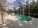 Screened-in pool area featuring a uniquely shaped pool and an expansive deck, perfect for entertaining at 1948 Bridgeview Cir, Orlando, FL 32824