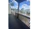 This is a view from the wood-decked balcony that overlooks the street and other apartments at 228 Scottsdale Sq # 228, Winter Park, FL 32792