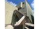 Exterior shot of a beige apartment building with stairs leading to the entrance at 228 Scottsdale Sq # 228, Winter Park, FL 32792
