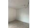 Empty room with tiled flooring, plain walls, and a fluorescent light fixture on the ceiling at 228 Scottsdale Sq # 228, Winter Park, FL 32792