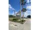 The Winter Park Woods community sign is surrounded by palms and landscaping at 228 Scottsdale Sq # 228, Winter Park, FL 32792