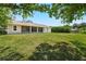Large backyard with green grass showing the back patio of the house at 2374 Eagle Trace Dr, Kissimmee, FL 34746