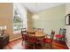 Dining area features wood floors, a large window with lots of natural light, and classic furnishings at 2374 Eagle Trace Dr, Kissimmee, FL 34746
