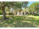 Charming one-story home with well-manicured lawn and mature trees providing ample shade at 2374 Eagle Trace Dr, Kissimmee, FL 34746