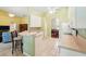 Open kitchen with tile floors, breakfast bar and access to dining room at 2374 Eagle Trace Dr, Kissimmee, FL 34746