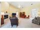 Open living room with fireplace, entertainment center and comfortable seating at 2374 Eagle Trace Dr, Kissimmee, FL 34746