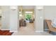 Open-concept living area with neutral tones, cozy seating, and lots of natural light at 2374 Eagle Trace Dr, Kissimmee, FL 34746