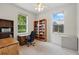 Bright home office with natural light, built-in bookshelves, and a functional desk area at 2374 Eagle Trace Dr, Kissimmee, FL 34746